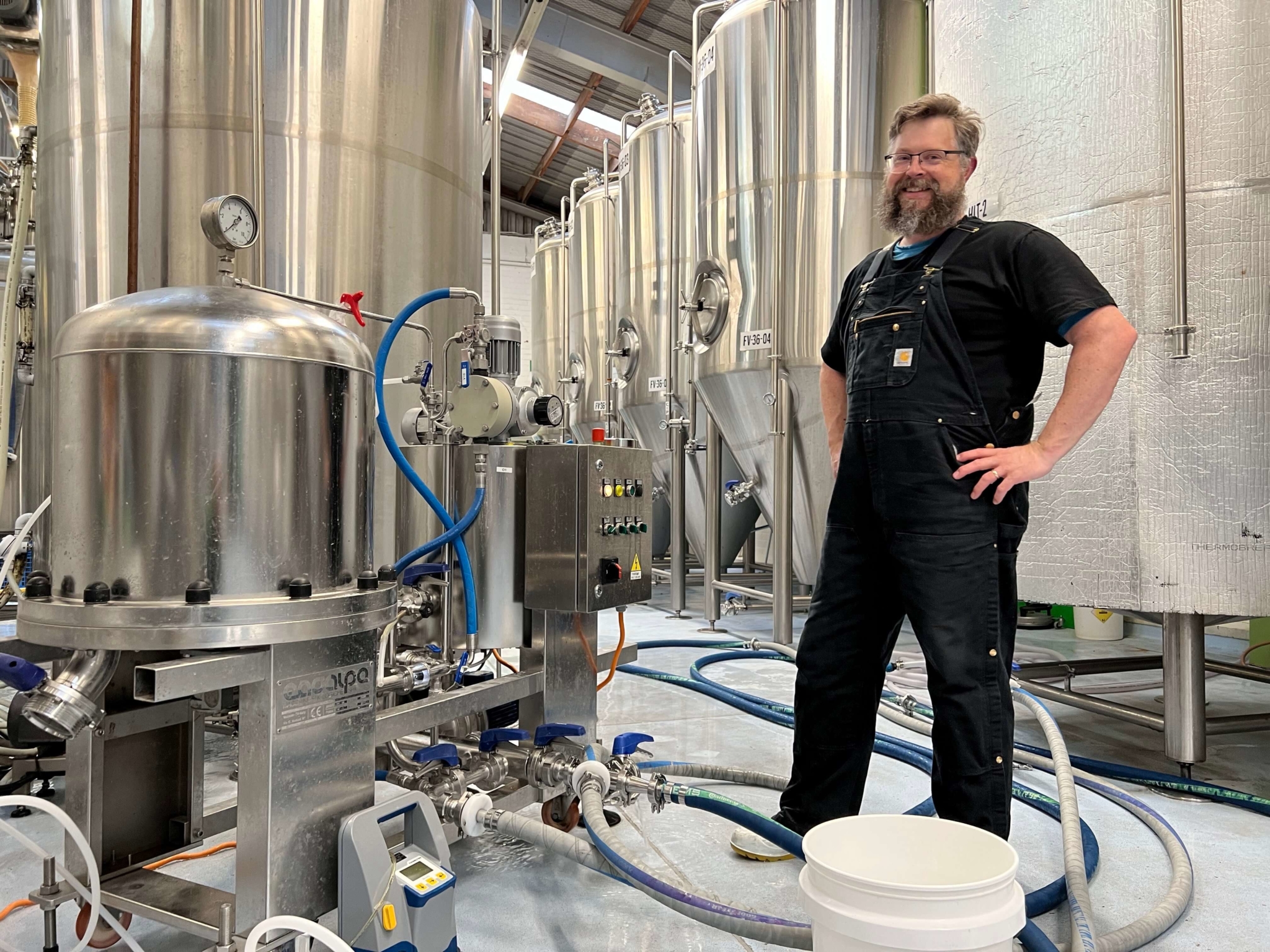 Chris prepares to filter beer.